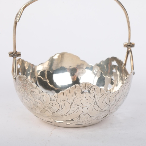 1897 - A Chinese export silver 'Chrysanthemum' swing-handled bon bon basket, retailed by Zeewu, pierced and... 