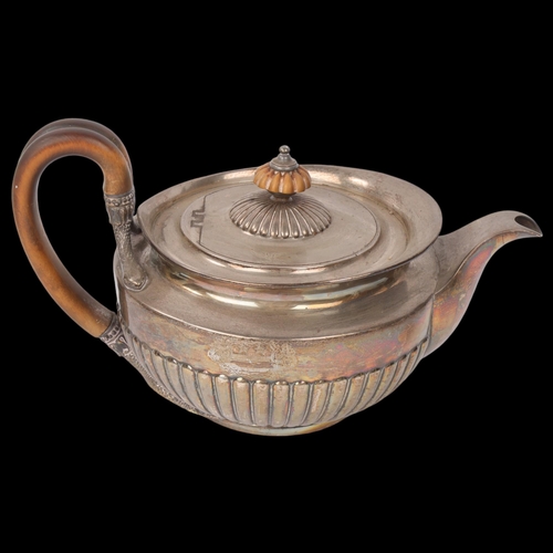 1902 - A George III silver teapot, William Burwash, London 1813, circular squat form with relief embossed h... 