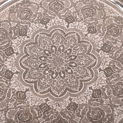 1907 - An Antique Persian silver tray, allover chased and engraved foliate decoration, with cast rim, unmar... 