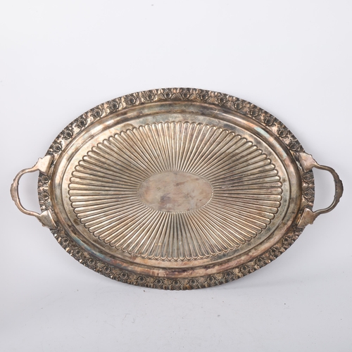 1909 - A late Victorian silver 2-handled tea tray, Roberts & Belk, Sheffield 1898, oval form with relief em... 