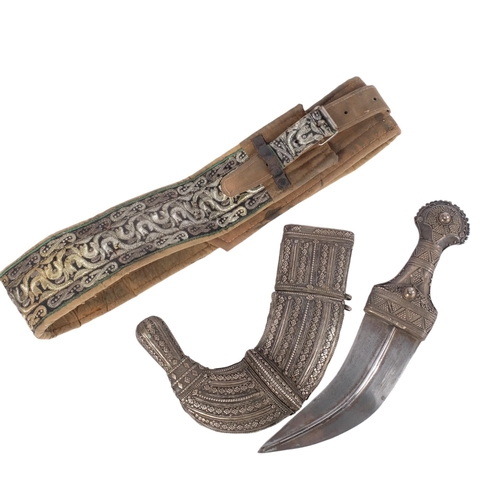 42 - An Antique Jambiya dagger with sheath, length approx 40cm, and ceremonial fabric belt (2)