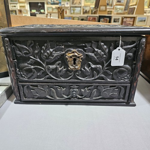 14 - An early 19th century Sri Lankan ebony box, circa 1830, relief carved allover with hinged lid and dr... 