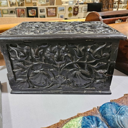 14 - An early 19th century Sri Lankan ebony box, circa 1830, relief carved allover with hinged lid and dr... 