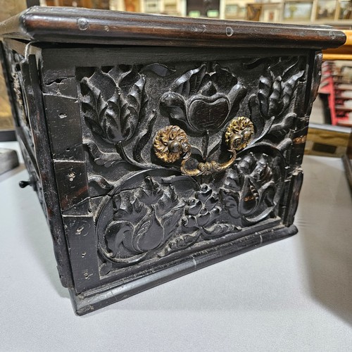 14 - An early 19th century Sri Lankan ebony box, circa 1830, relief carved allover with hinged lid and dr... 