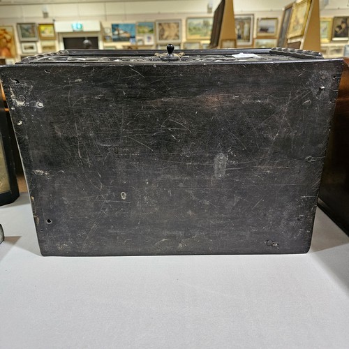 14 - An early 19th century Sri Lankan ebony box, circa 1830, relief carved allover with hinged lid and dr... 