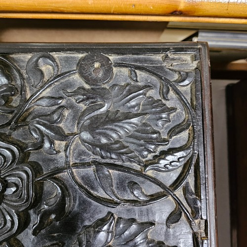 14 - An early 19th century Sri Lankan ebony box, circa 1830, relief carved allover with hinged lid and dr... 