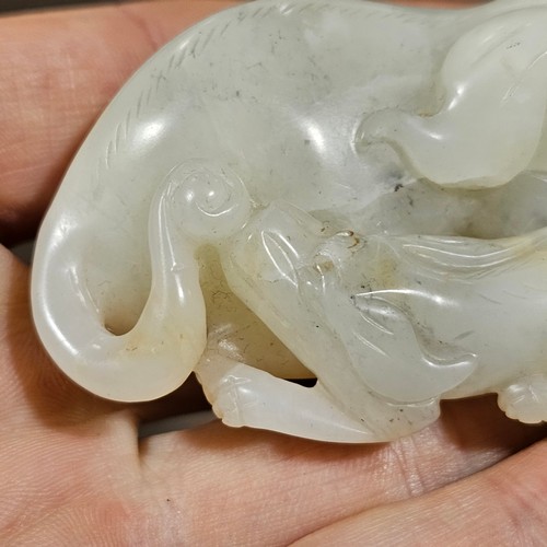 148 - A Chinese relief carved jade buffalo and calf, Qing Dynasty, length 7cm