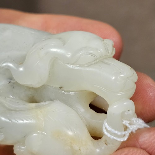 148 - A Chinese relief carved jade buffalo and calf, Qing Dynasty, length 7cm