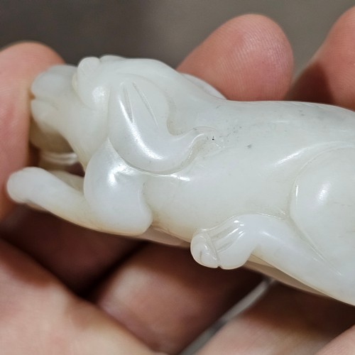 148 - A Chinese relief carved jade buffalo and calf, Qing Dynasty, length 7cm