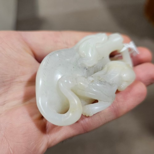 148 - A Chinese relief carved jade buffalo and calf, Qing Dynasty, length 7cm