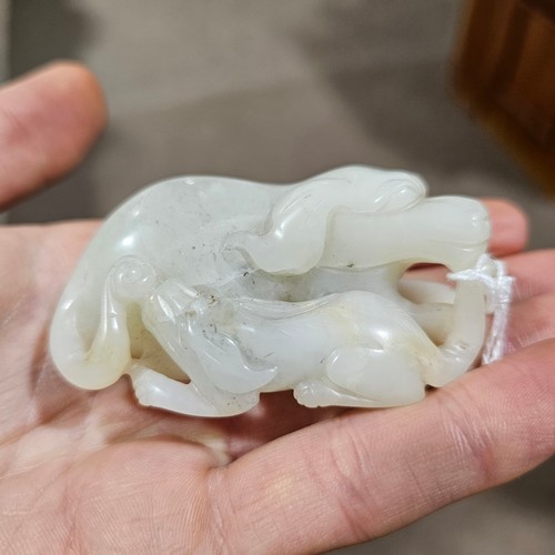 148 - A Chinese relief carved jade buffalo and calf, Qing Dynasty, length 7cm