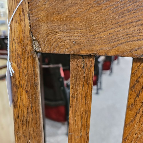 151 - An oak Arts & Crafts chair by James Shoolbred, Tottenham Court Road, London, with 6 legs and scrolle... 