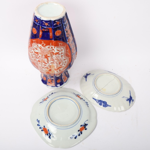 196 - A Chinese blue and red decorated Imari porcelain vase, height 30cm, and 2 similar Imari plates (1 br... 