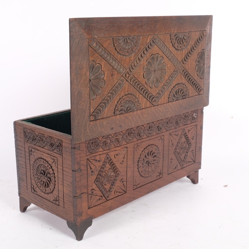 14 - A small oak carved coffer, possibly an apprentice piece, L30cm