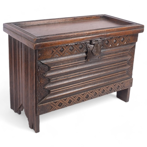 15 - An apprentice piece oak coffer, with a selection of different carved and applied decoration, includi... 