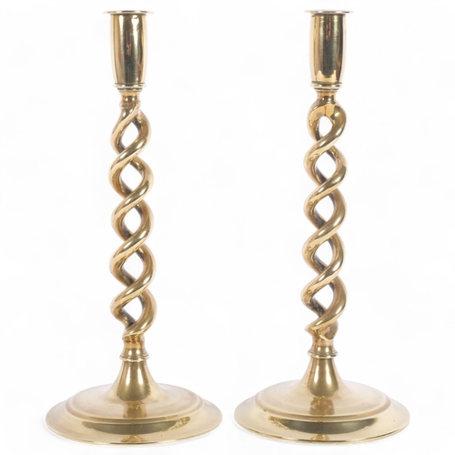 20 - A pair of brass open barley twist column candlesticks, H30cm