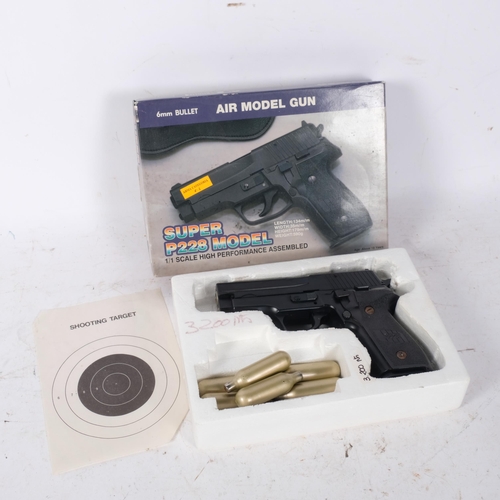 33 - A Super P228 model 6mm air pistol, boxed