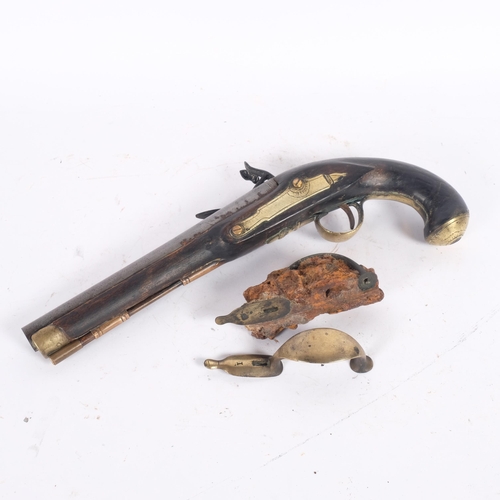 39 - 18th century brass-mounted flintlock pistol, originally trawled up in Rye Bay and made up as a displ... 