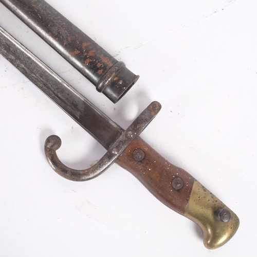 45 - A 1866 pattern French Chassepot bayonet and scabbard, pattern on. 95225 to the guard and matching nu... 