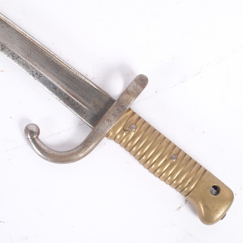 47 - An 1866 pattern French bayonet, steel guard and brass handle, guard numbered 8234, L69cm