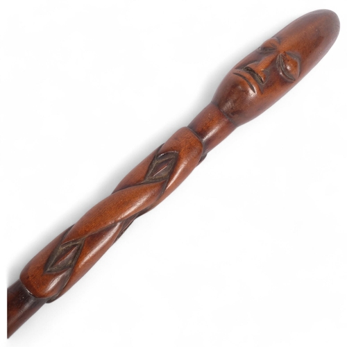 54 - An African hardwood figural club, interwoven body, L54cm