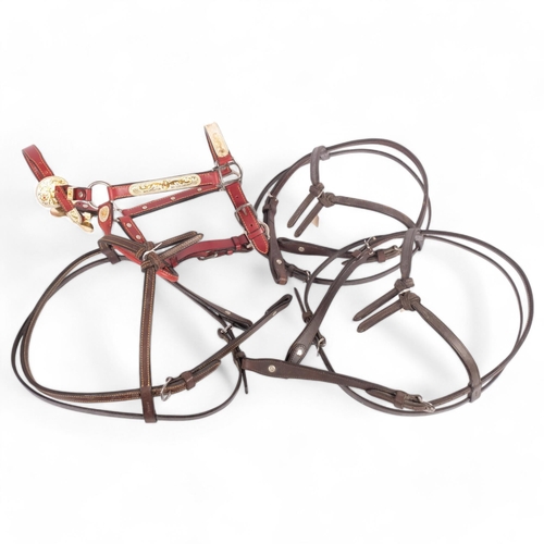 63 - A bespoke made red leather and metal-mounted horse's bridle, and 3 others, all from the workshop of ... 