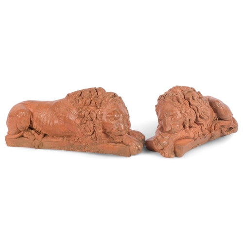 64 - A pair of terracotta recumbent lions, L30cm