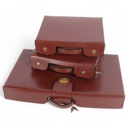 68 - A brown leather briefcase with sectional interior, with shoulder strap, together with a pair of smal... 