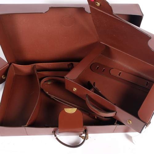 68 - A brown leather briefcase with sectional interior, with shoulder strap, together with a pair of smal... 