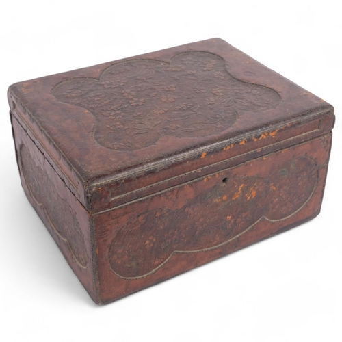 70 - An Antique tooled leather box, having a lift-out sectional tray, floral embossed panel decoration, 3... 