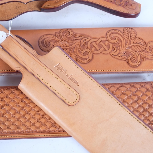 72 - A group of 3 tooled tanned leather machete scabbards, overall length 49cm, together with a tan toole... 