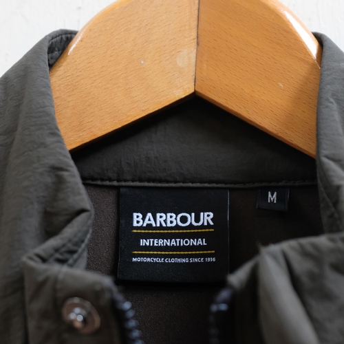 117 - Barbour International, a green quilted jacket, size M