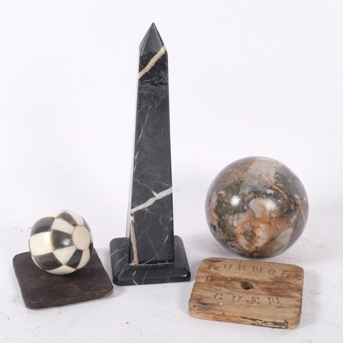 151 - A two-colour marble obelisk, H21cm, a specimen marble ball, and another (3)