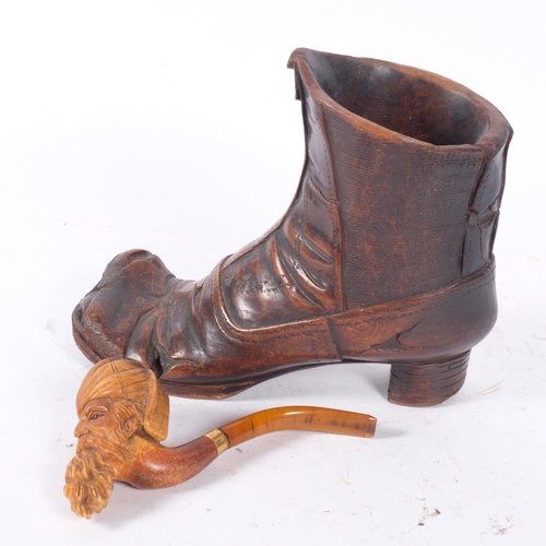 166 - An early 20th century carved treen boot, H16cm, and a Meerschaum pipe with a bowl in the form of a S... 