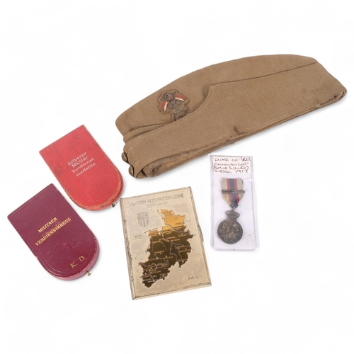 179 - A group of military items, including a Senior Officer's side cap with bullion badge, 2 Austrian meda... 