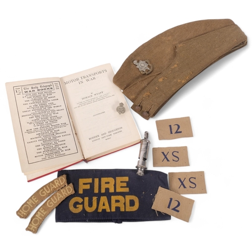 181 - A group of military items, including a Sussex side hat, a Fire Guard armband, The Daily Telegraph Wa... 