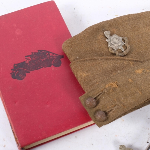 181 - A group of military items, including a Sussex side hat, a Fire Guard armband, The Daily Telegraph Wa... 