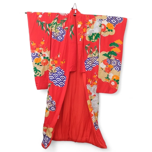 183 - A Japanese red printed and embroidered kimono