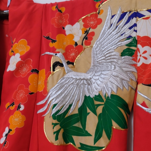 183 - A Japanese red printed and embroidered kimono