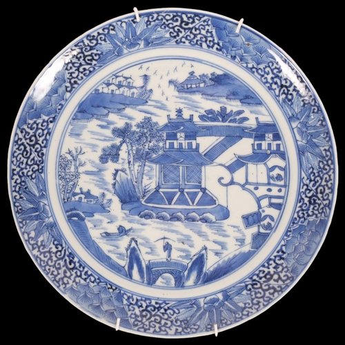 184 - A 19th century  Chinese blue and white plate, with pagoda decoration, diameter 24cm