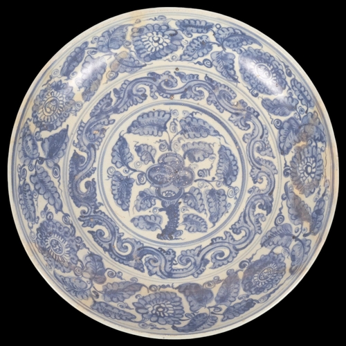 190 - A Chinese blue and white porcelain bowl, with painted leaf decoration, diameter 32cm, restored