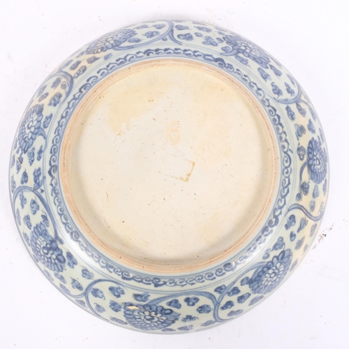 190 - A Chinese blue and white porcelain bowl, with painted leaf decoration, diameter 32cm, restored