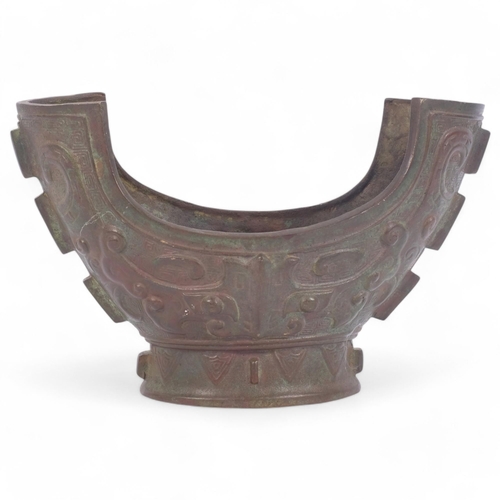 193 - A Chinese Archaic bronze brutalist design vessel, engraved embossed decoration, diameter 28cm