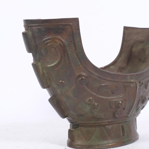 193 - A Chinese Archaic bronze brutalist design vessel, engraved embossed decoration, diameter 28cm