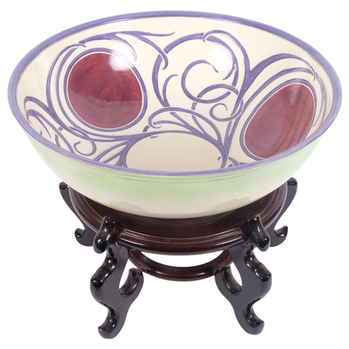 204 - A large Royal Doulton Art Nouveau wash bowl, diameter 39cm, on a Chinese design hardwood stand