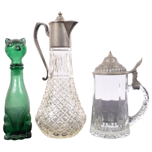 209 - A moulded glass Claret jug with plated mounts, a glass tankard with pewter lid, and a glass design b... 