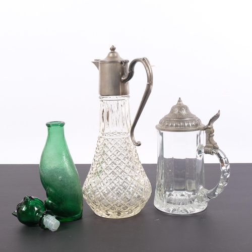 209 - A moulded glass Claret jug with plated mounts, a glass tankard with pewter lid, and a glass design b... 