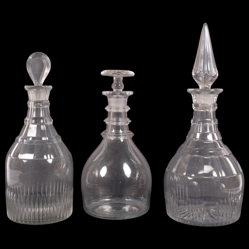 220 - A Whitefriars clear glass decanter and stopper, and 2 other decanters and stoppers, tallest 32cm