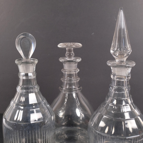 220 - A Whitefriars clear glass decanter and stopper, and 2 other decanters and stoppers, tallest 32cm