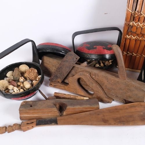 231 - A group of various Oriental baskets, carriers, tools, and an Indonesian lute